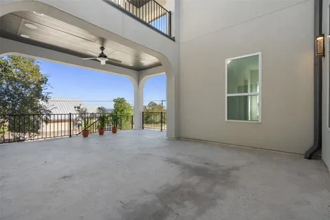 a front view of a house with large windows