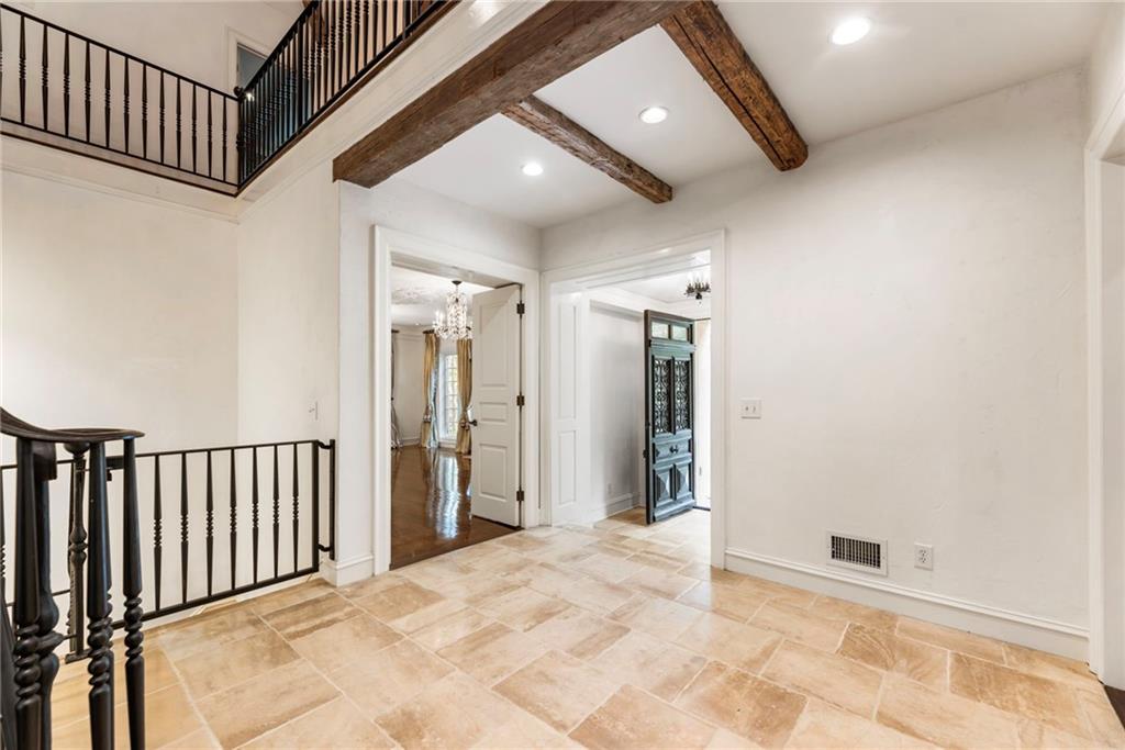 2485 West Wesley Road Northwest Atlanta, GA 30327 - Photo 13 of 84 a view of a hallway with wooden floor and staircase