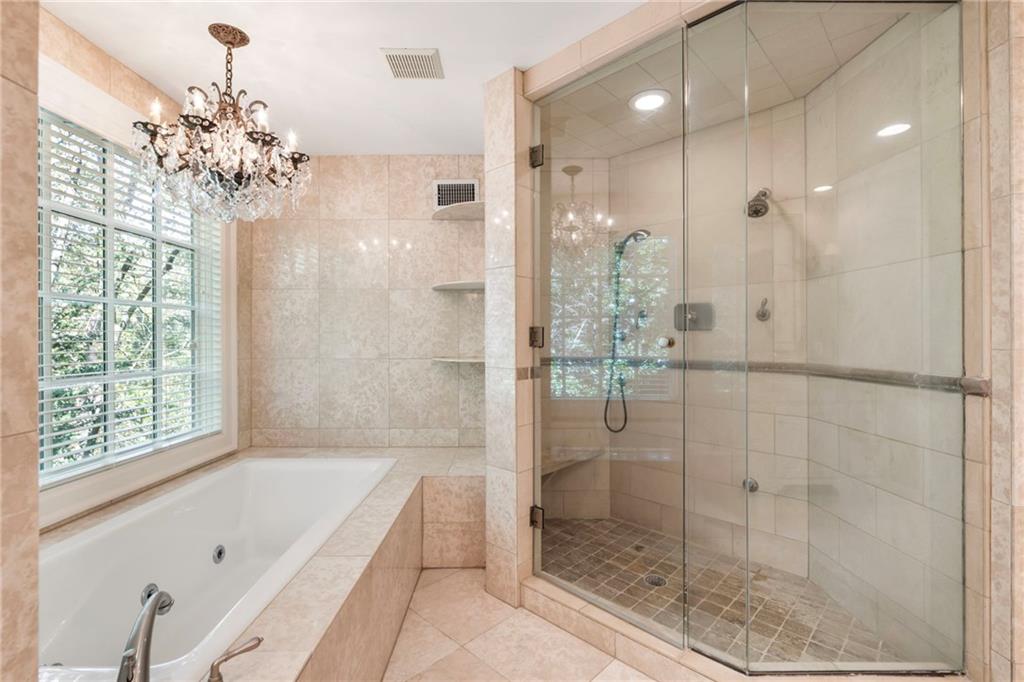 2485 West Wesley Road Northwest Atlanta, GA 30327 - Photo 39 of 84 a bathroom with a shower and a bathtub