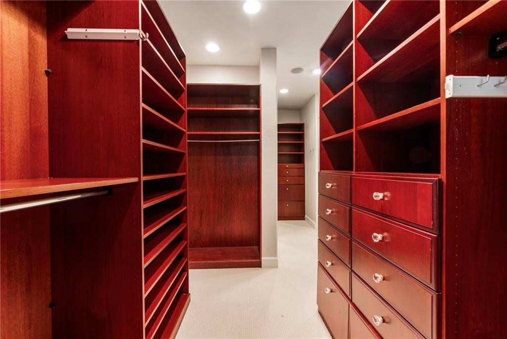 2485 West Wesley Road Northwest Atlanta, GA 30327 - Photo 40 of 84 a view of walk in closet with empty racks