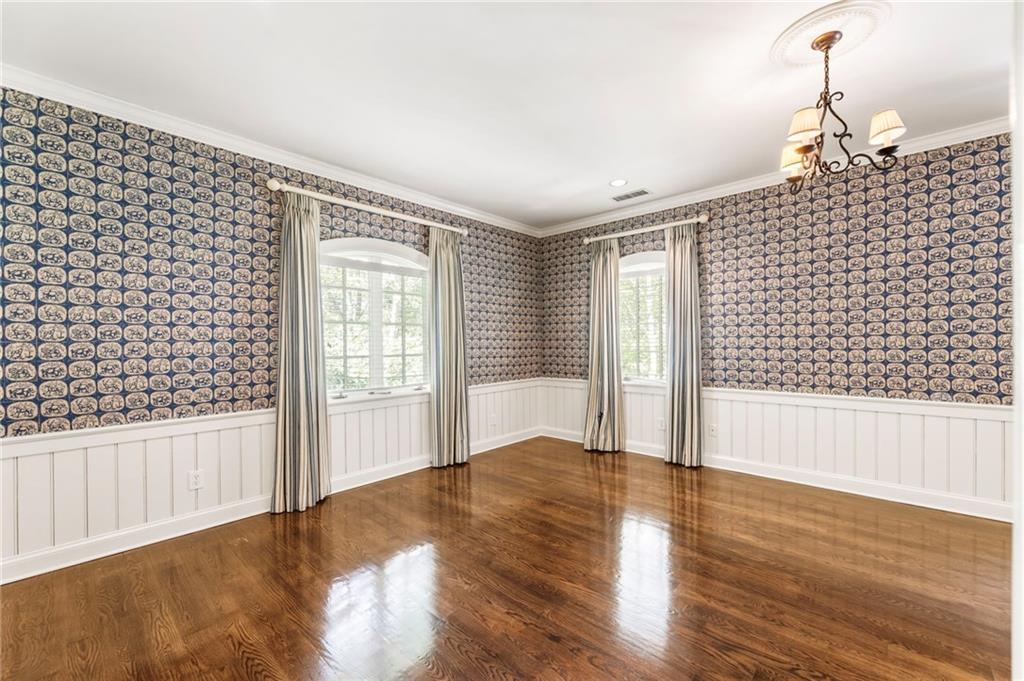 2485 West Wesley Road Northwest Atlanta, GA 30327 - Photo 46 of 84 a view of an empty room and wooden floor
