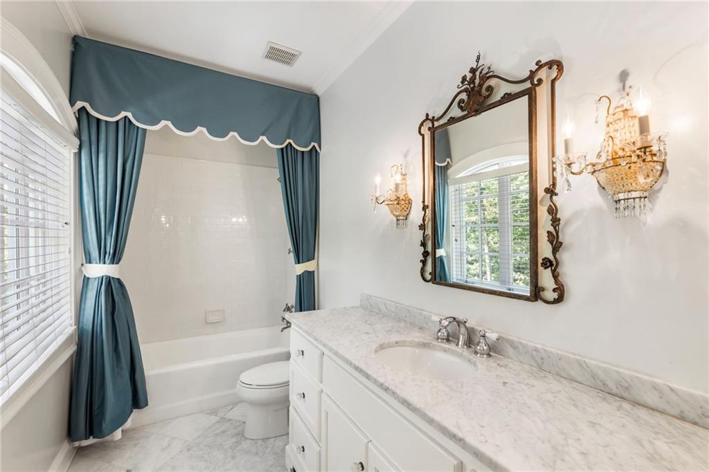 2485 West Wesley Road Northwest Atlanta, GA 30327 - Photo 51 of 84 a bathroom with a granite countertop sink toilet and shower