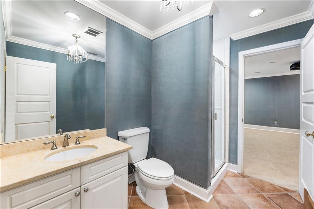 2485 West Wesley Road Northwest Atlanta, GA 30327 - Photo 65 of 84 a bathroom with a sink toilet and shower
