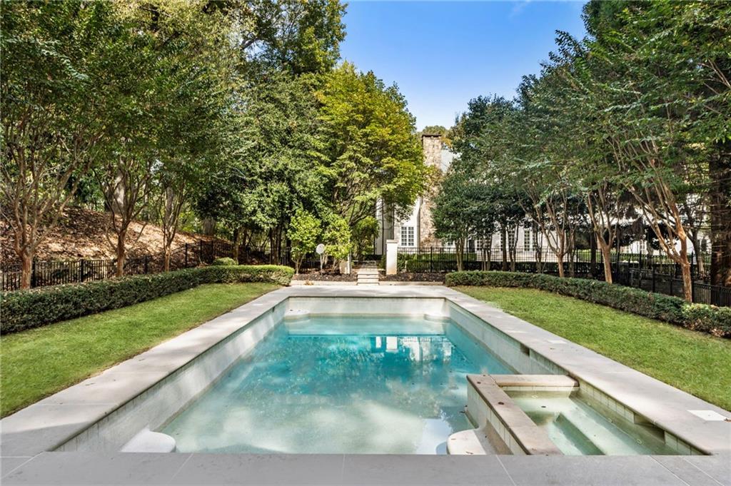 2485 West Wesley Road Northwest Atlanta, GA 30327 - Photo 75 of 84 a view of swimming pool with a garden and trees