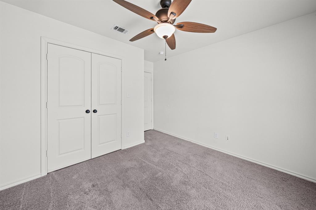 229 Firefly Drive Springtown, TX 76082 - Photo 19 of 33 Neutral wall color with plush carpet flooring