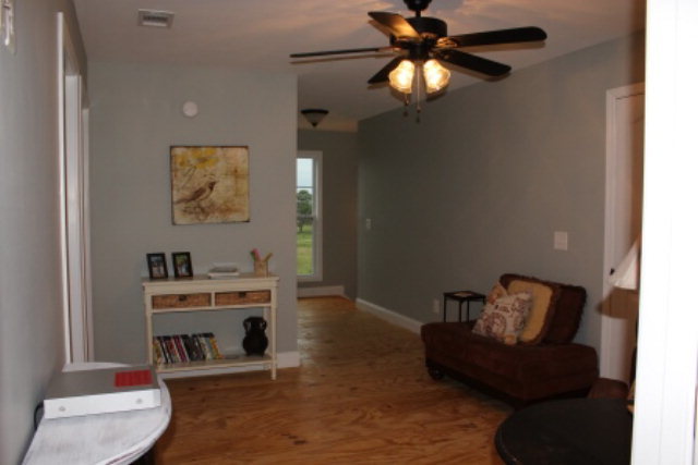 700 King Road Forsyth, GA 31029 - Photo 13 of 22 a living room with furniture and a chandelier