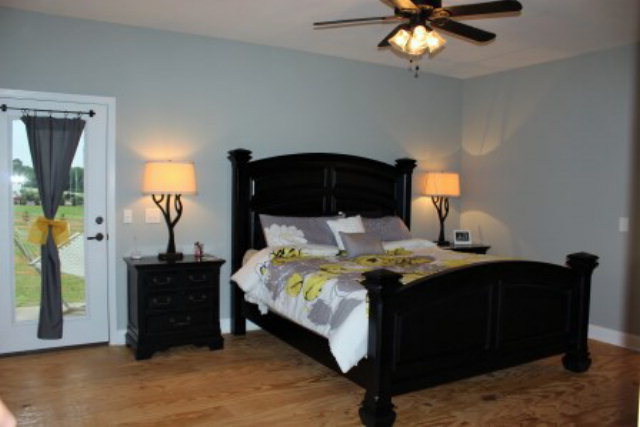 700 King Road Forsyth, GA 31029 - Photo 14 of 22 a bedroom with a bed and a chandelier