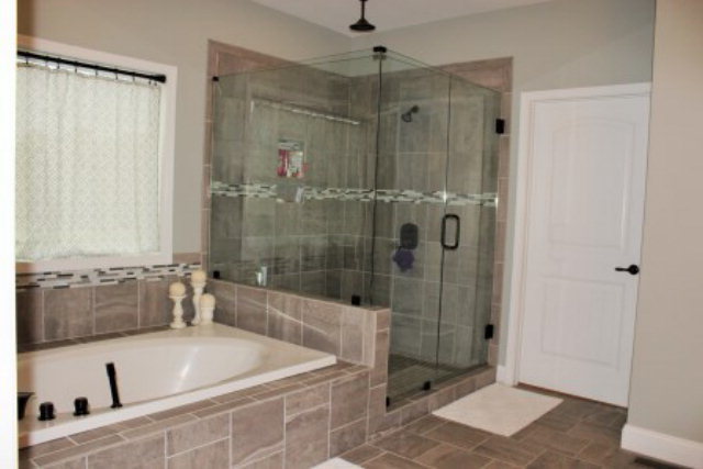 700 King Road Forsyth, GA 31029 - Photo 15 of 22 a bathroom with a tub a sink and shower
