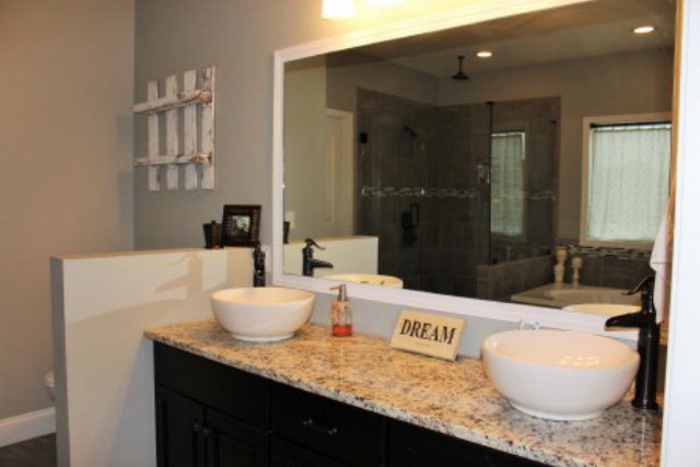 700 King Road Forsyth, GA 31029 - Photo 19 of 22 a bathroom with a granite countertop sink and a mirror