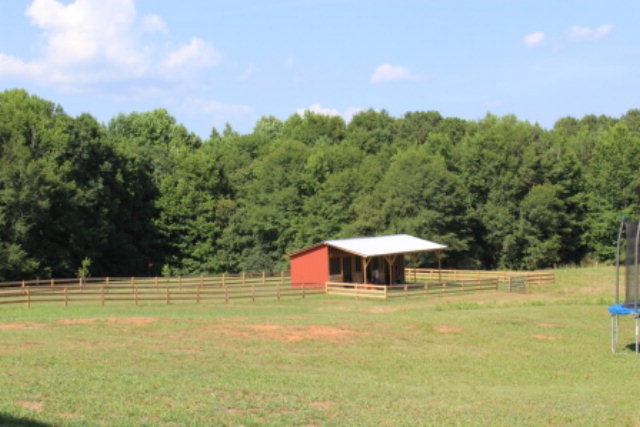 700 King Road Forsyth, GA 31029 - Photo 21 of 22 a view of a swimming pool with a yard