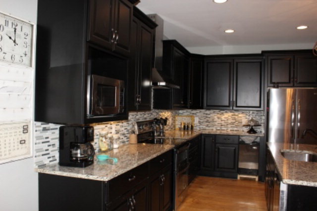 700 King Road Forsyth, GA 31029 - Photo 9 of 22 a kitchen with stainless steel appliances granite countertop a sink stove and refrigerator