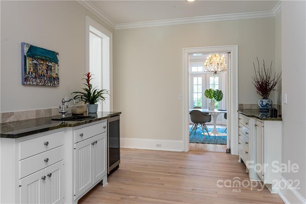 343 Vanderbilt Road Asheville, NC 28803 - Photo 14 of 48 a hallway with sink and mirror