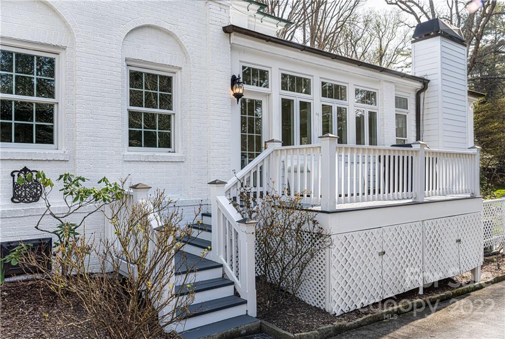 343 Vanderbilt Road Asheville, NC 28803 - Photo 19 of 48 a view of a house with a deck