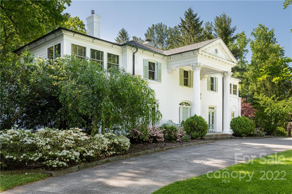 343 Vanderbilt Road Asheville, NC 28803 - Photo 2 of 48 a front view of a house with garden