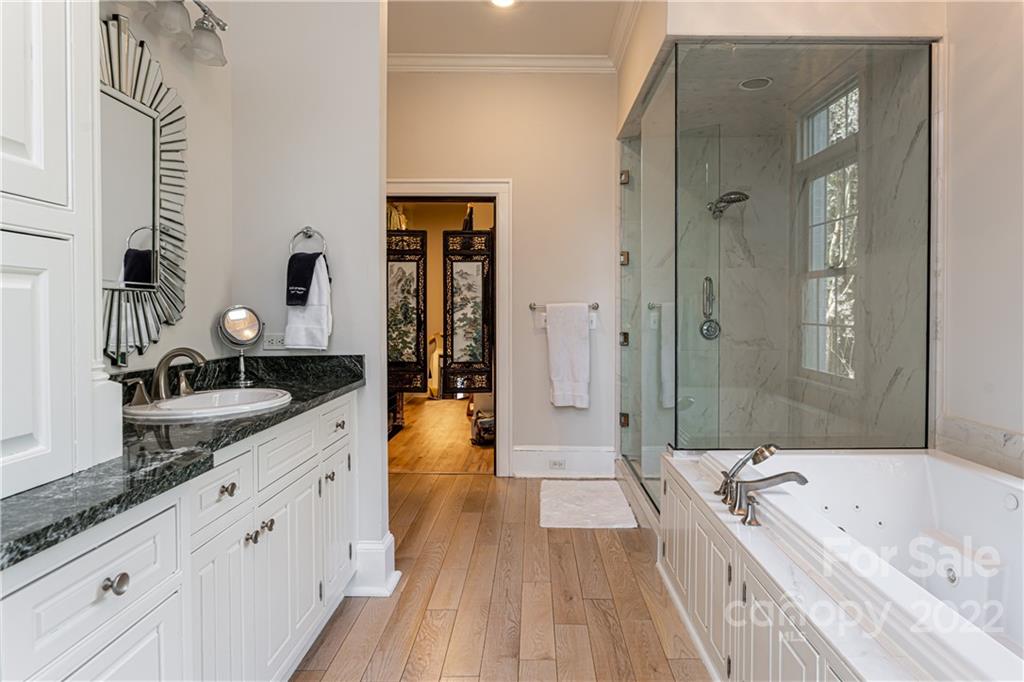 343 Vanderbilt Road Asheville, NC 28803 - Photo 21 of 48 a large bathroom with a granite countertop tub double vanity sink and mirror