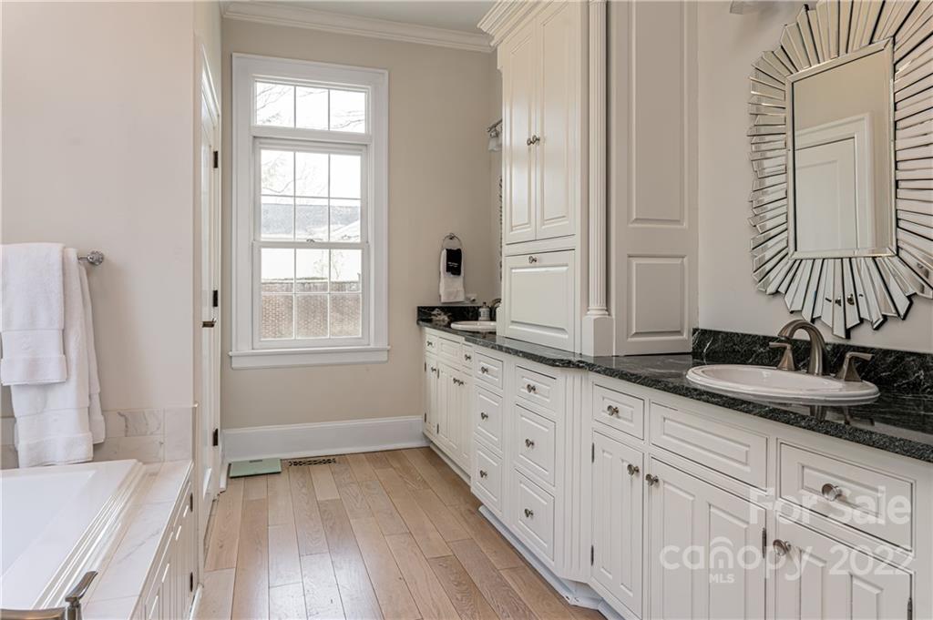 343 Vanderbilt Road Asheville, NC 28803 - Photo 22 of 48 a bathroom with double vanity and a granite counter tops