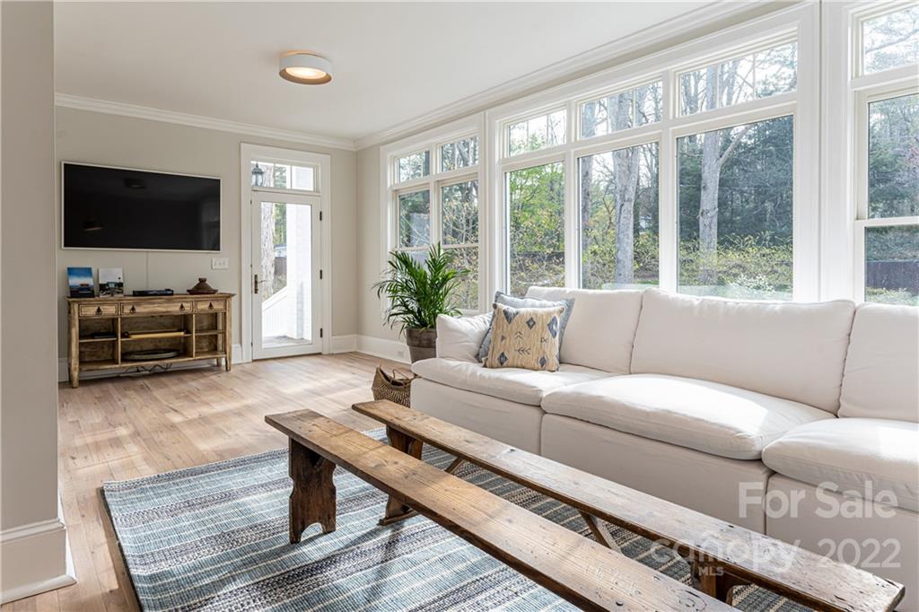 343 Vanderbilt Road Asheville, NC 28803 - Photo 25 of 48 a living room with furniture and a flat screen tv