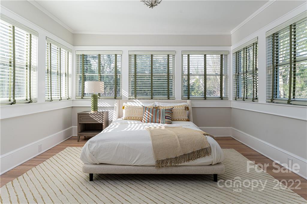 343 Vanderbilt Road Asheville, NC 28803 - Photo 29 of 48 a bedroom with a bed and a large window