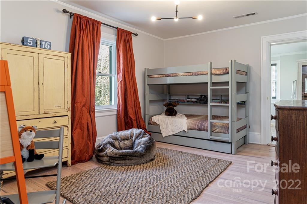 343 Vanderbilt Road Asheville, NC 28803 - Photo 31 of 48 a room with furniture and a window