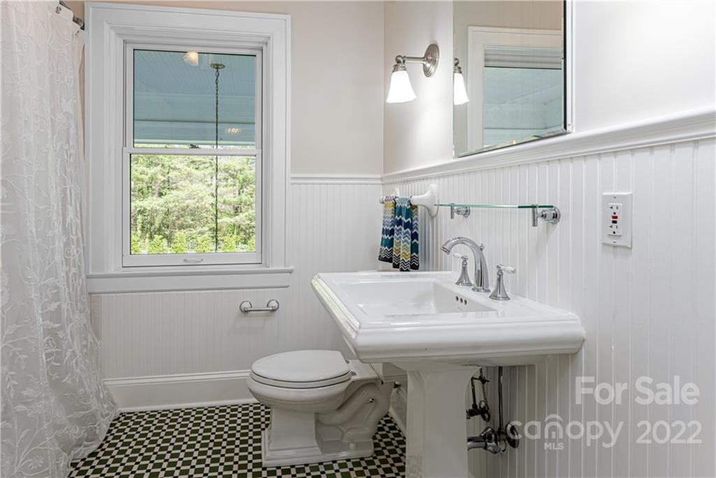 343 Vanderbilt Road Asheville, NC 28803 - Photo 32 of 48 a bathroom with a sink toilet and shower