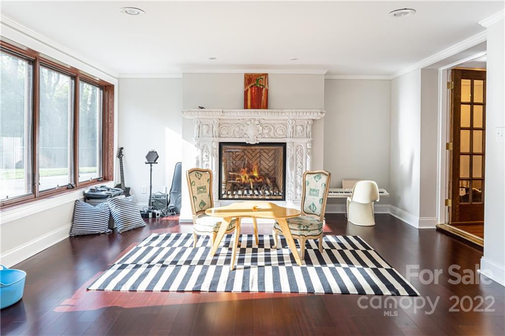 343 Vanderbilt Road Asheville, NC 28803 - Photo 35 of 48 a living room with furniture and a fireplace