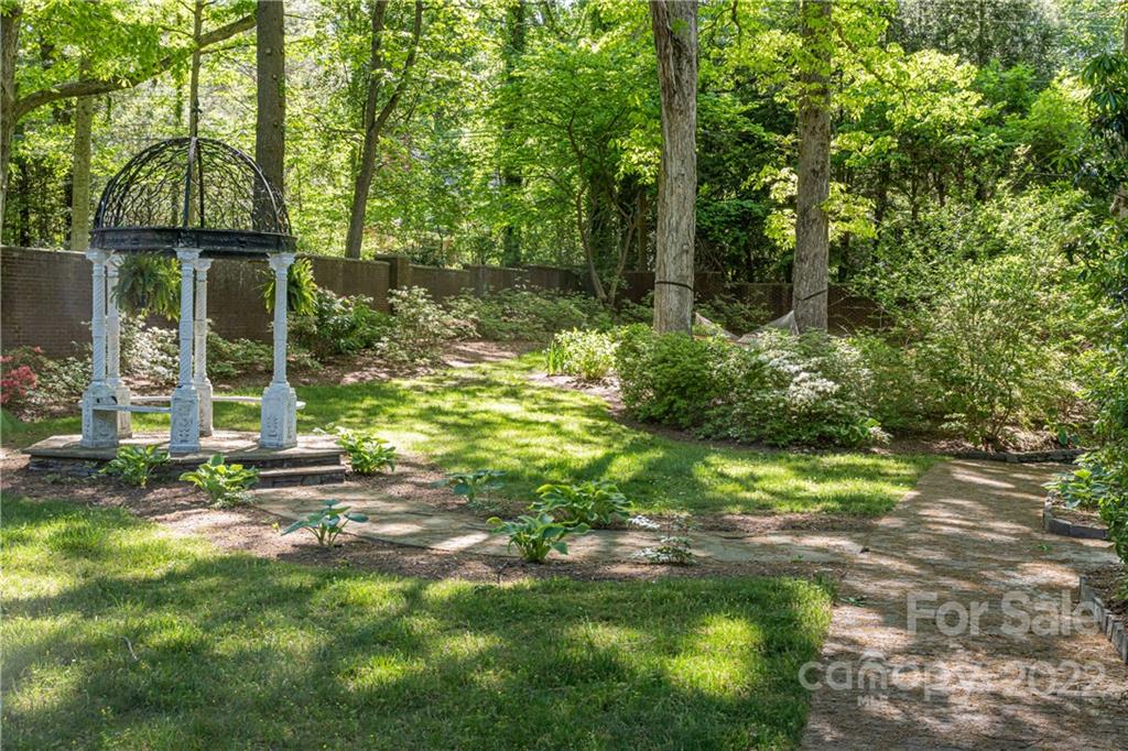 343 Vanderbilt Road Asheville, NC 28803 - Photo 40 of 48 a backyard of a house with lots of green space