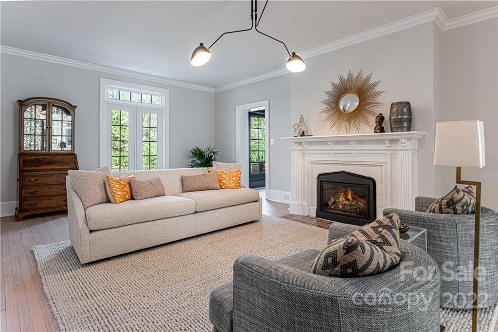 343 Vanderbilt Road Asheville, NC 28803 - Photo 4 of 48 a living room with furniture and a fireplace