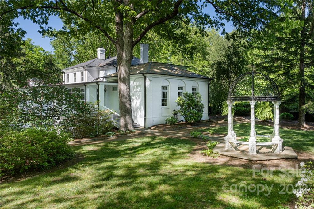 343 Vanderbilt Road Asheville, NC 28803 - Photo 43 of 48 a house view with a garden space