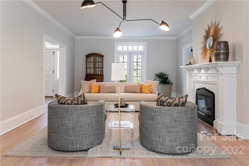 343 Vanderbilt Road Asheville, NC 28803 - Photo 6 of 48 a living room with couches and a fireplace