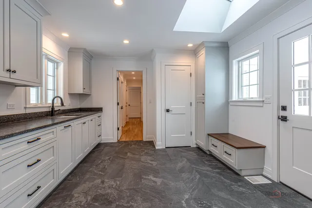 a picture of a wall with a white wall and a white refrigerator