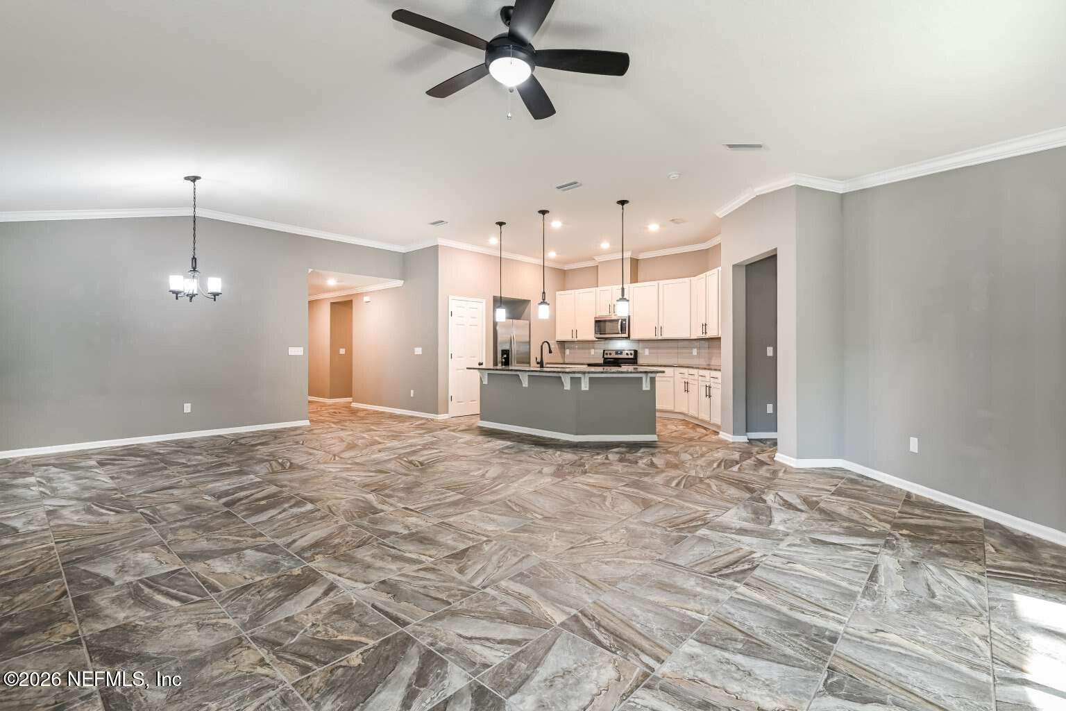 97572 Albatross Drive Yulee, FL 32097 - Photo 11 of 20 a view of a kitchen with a stove and a window