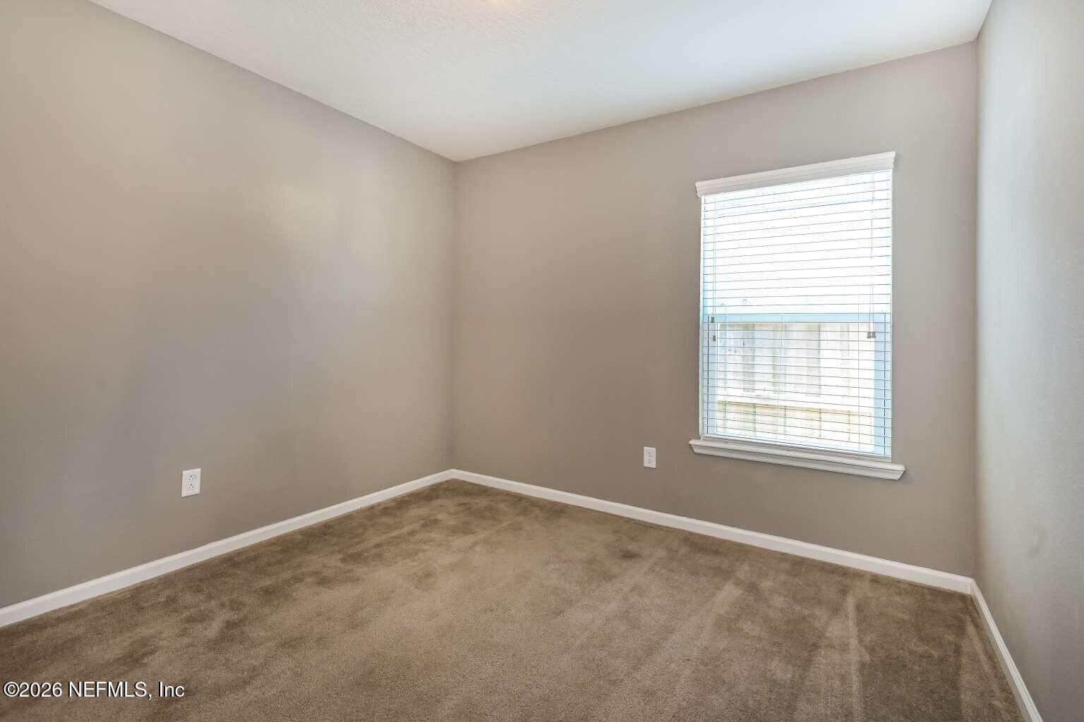 97572 Albatross Drive Yulee, FL 32097 - Photo 16 of 20 a view of an empty room with a window
