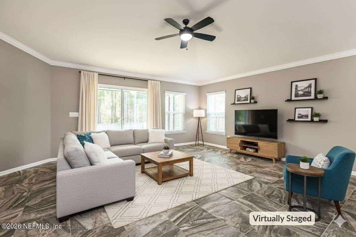 97572 Albatross Drive Yulee, FL 32097 - Photo 2 of 20 a living room with furniture and a flat screen tv