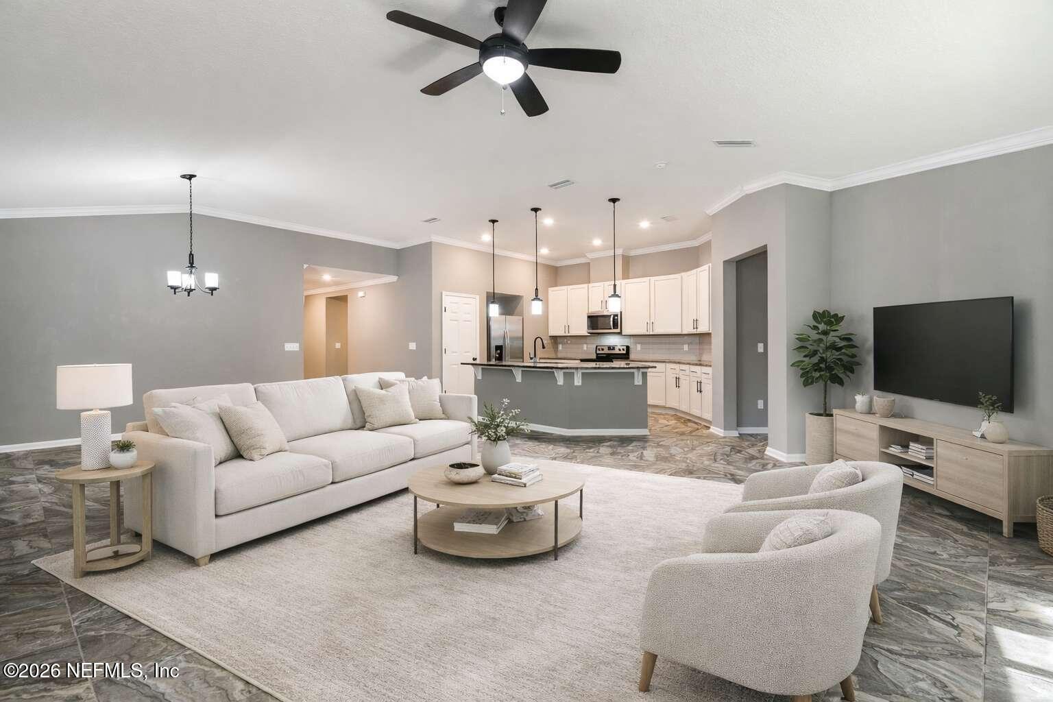 97572 Albatross Drive Yulee, FL 32097 - Photo 3 of 20 a living room with furniture kitchen view and a flat screen tv