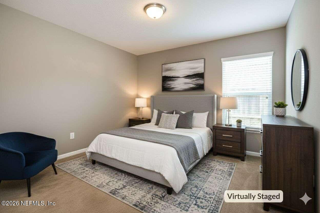 97572 Albatross Drive Yulee, FL 32097 - Photo 5 of 20 a bedroom with a bed and wooden floor