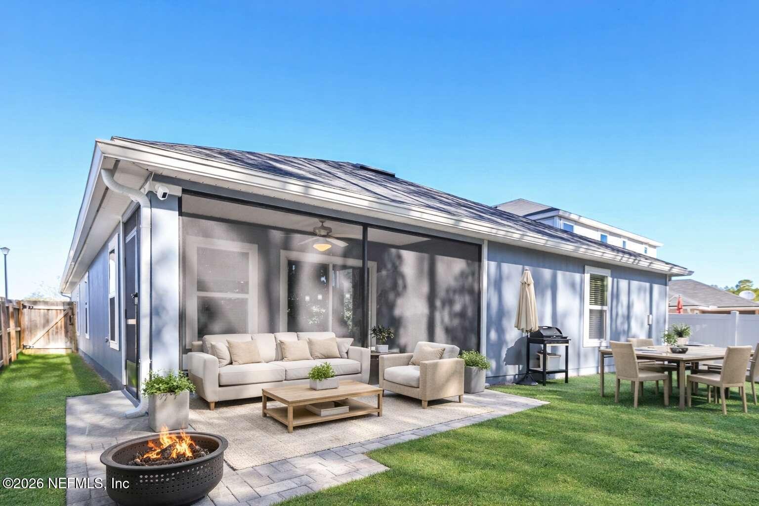 97572 Albatross Drive Yulee, FL 32097 - Photo 9 of 20 a patio with couches and a fire pit