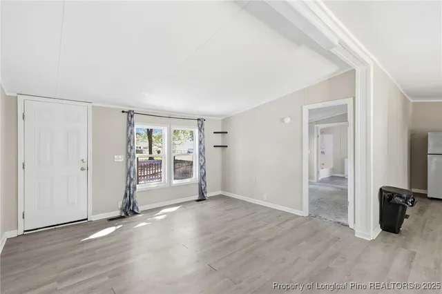 a view of a tree in the middle of a yard