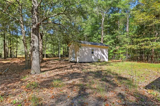a view of a backyard of the house