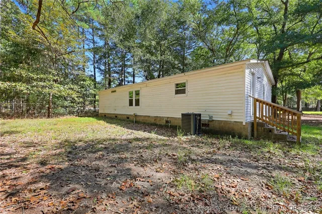 a backyard of a house with lots of green space