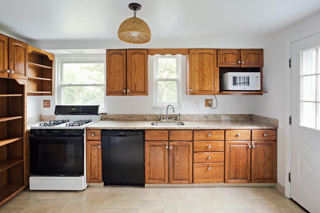 533 Highview Road Pittsburgh, PA 15234 - Photo 6 of 22 a kitchen with stainless steel appliances granite countertop a stove and a sink