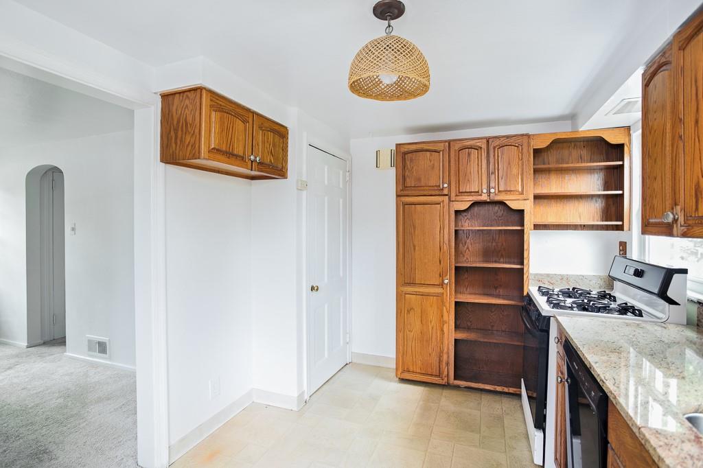 533 Highview Road Pittsburgh, PA 15234 - Photo 7 of 22 a view of kitchen with cabinets and wooden floor