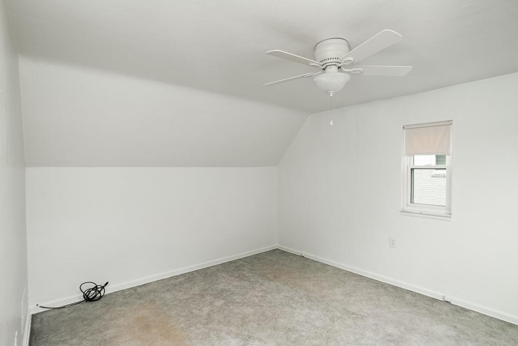 533 Highview Road Pittsburgh, PA 15234 - Photo 8 of 22 an empty room with a ceiling fan and a window