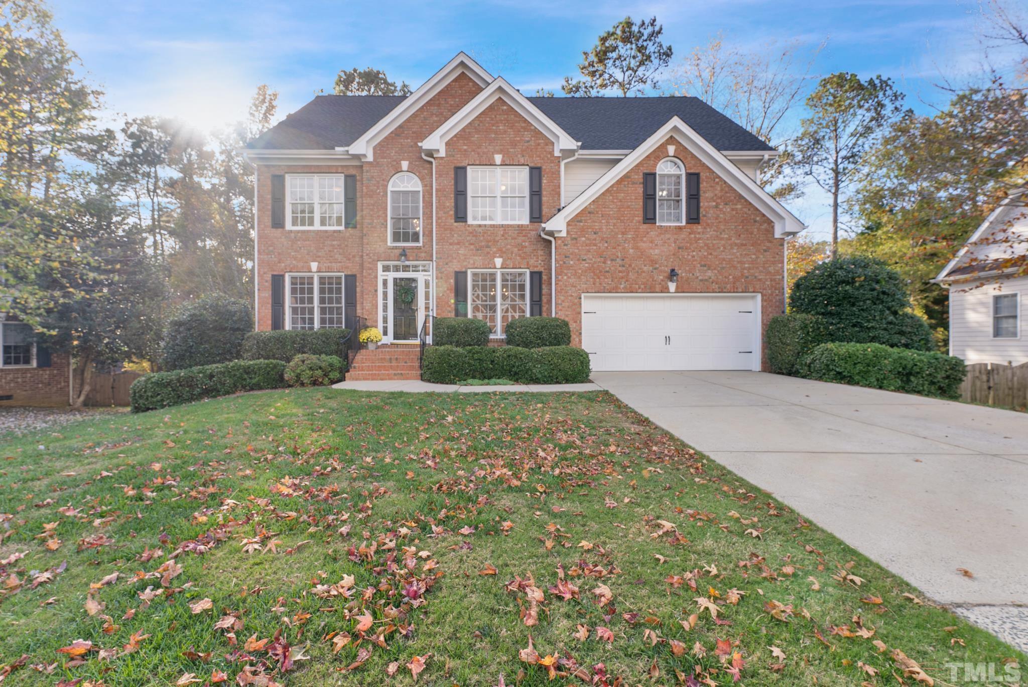8409 Aptos Court Raleigh, NC 27613 - Photo 1 of 46 a front view of a house with garden