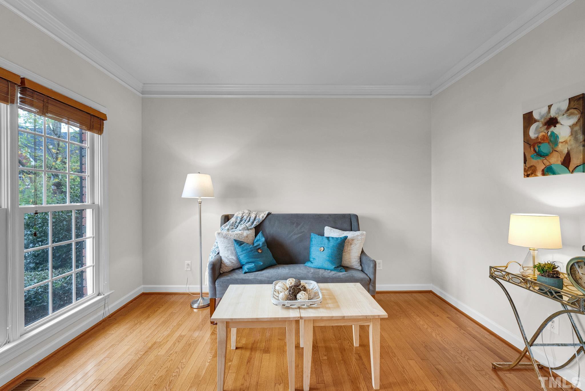 8409 Aptos Court Raleigh, NC 27613 - Photo 11 of 46 a bedroom with a bed and wooden floor