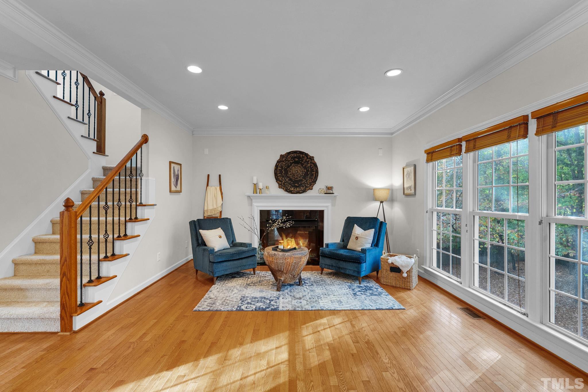 8409 Aptos Court Raleigh, NC 27613 - Photo 16 of 46 a view of living room with furniture and floor to ceiling window