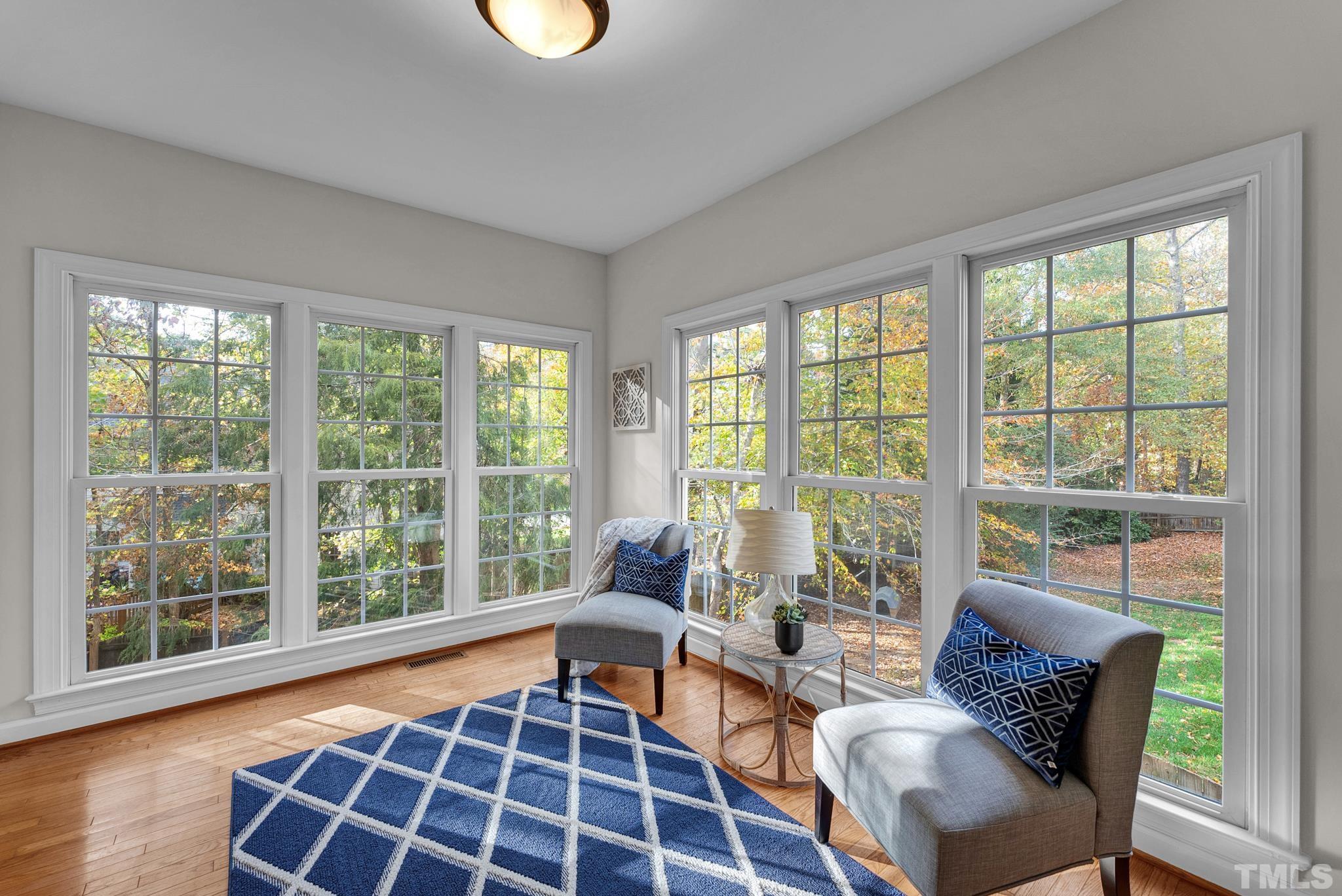 8409 Aptos Court Raleigh, NC 27613 - Photo 25 of 46 a living room with furniture and a large window