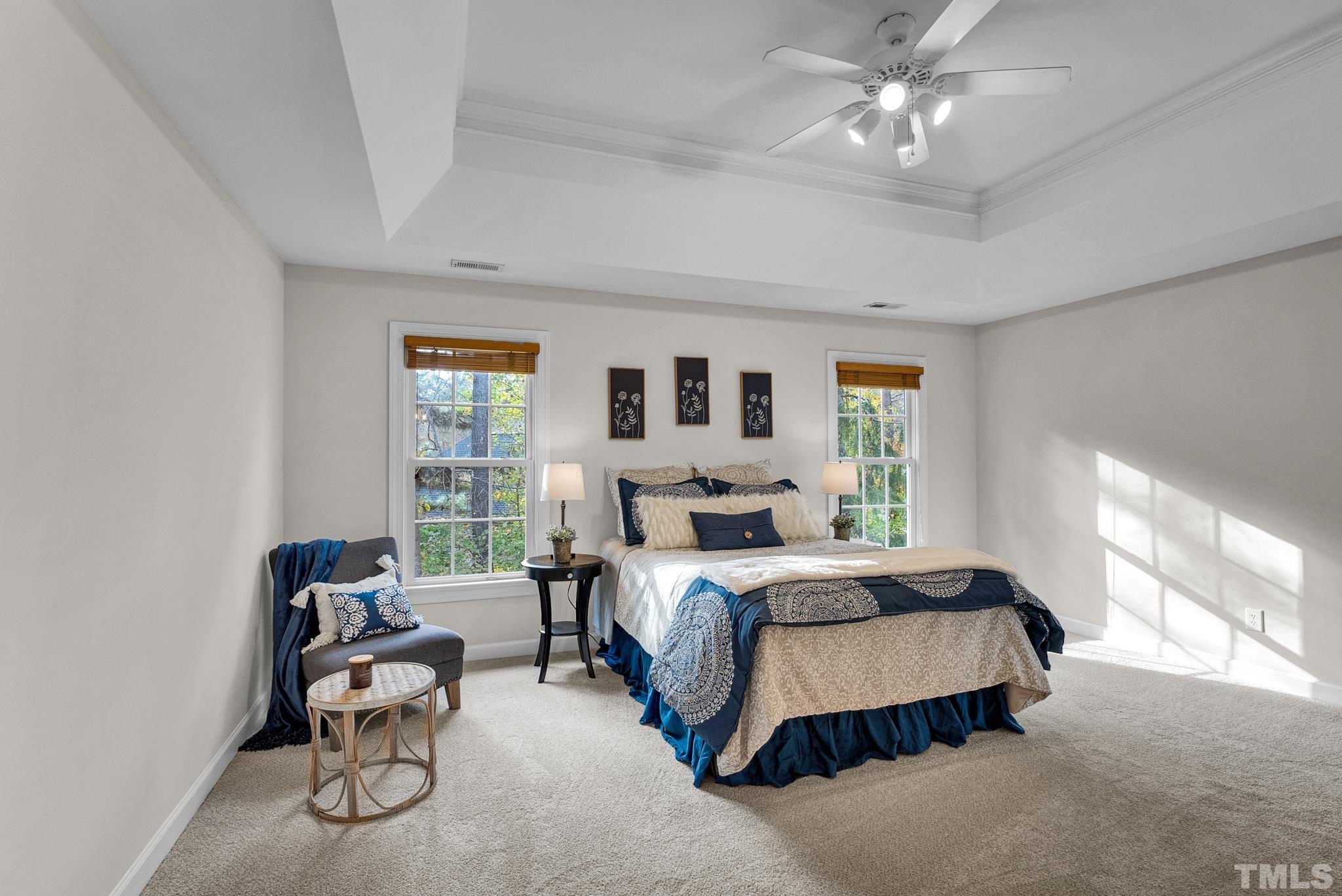 8409 Aptos Court Raleigh, NC 27613 - Photo 30 of 46 a bedroom with a bed chairs and window