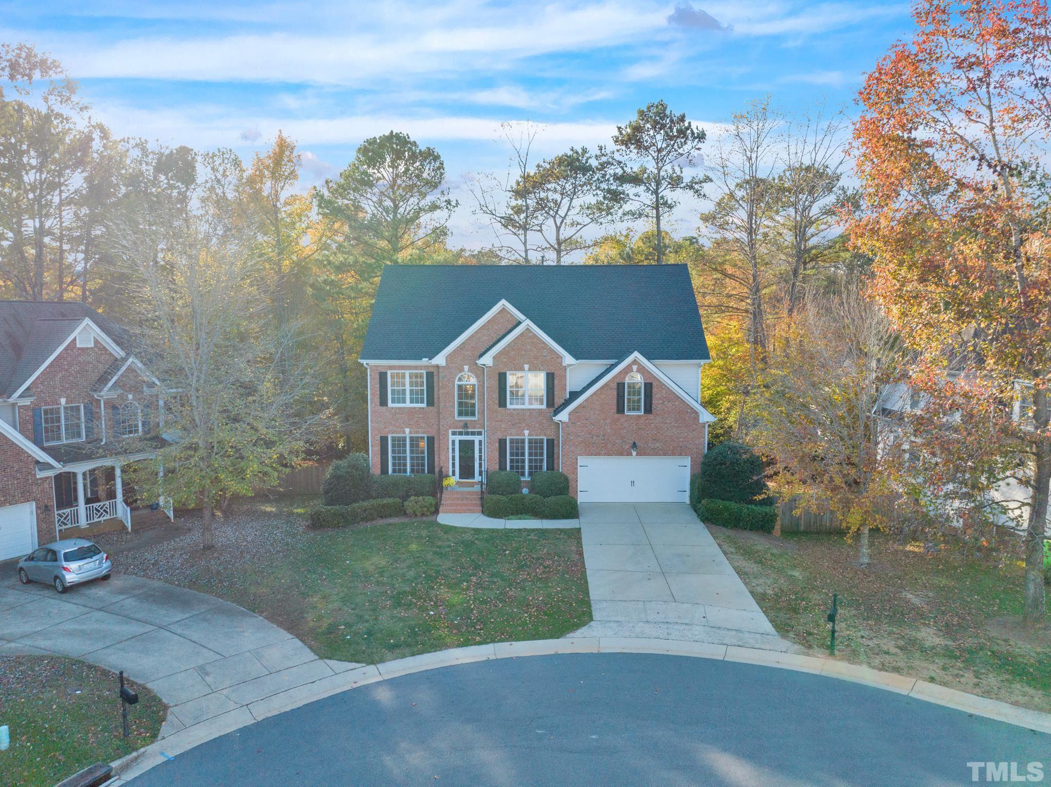 8409 Aptos Court Raleigh, NC 27613 - Photo 3 of 46 a front view of a house with a yard and garage