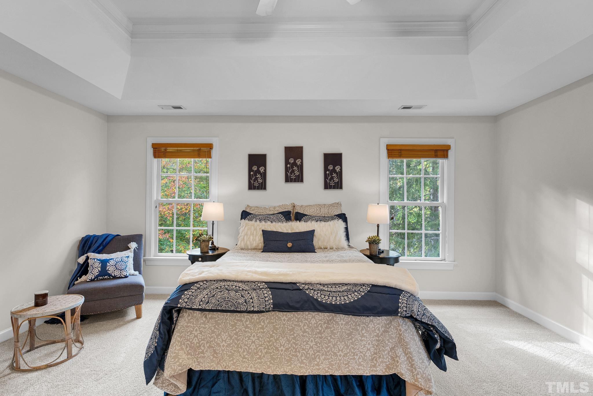 8409 Aptos Court Raleigh, NC 27613 - Photo 31 of 46 a bedroom with a large bed and a window