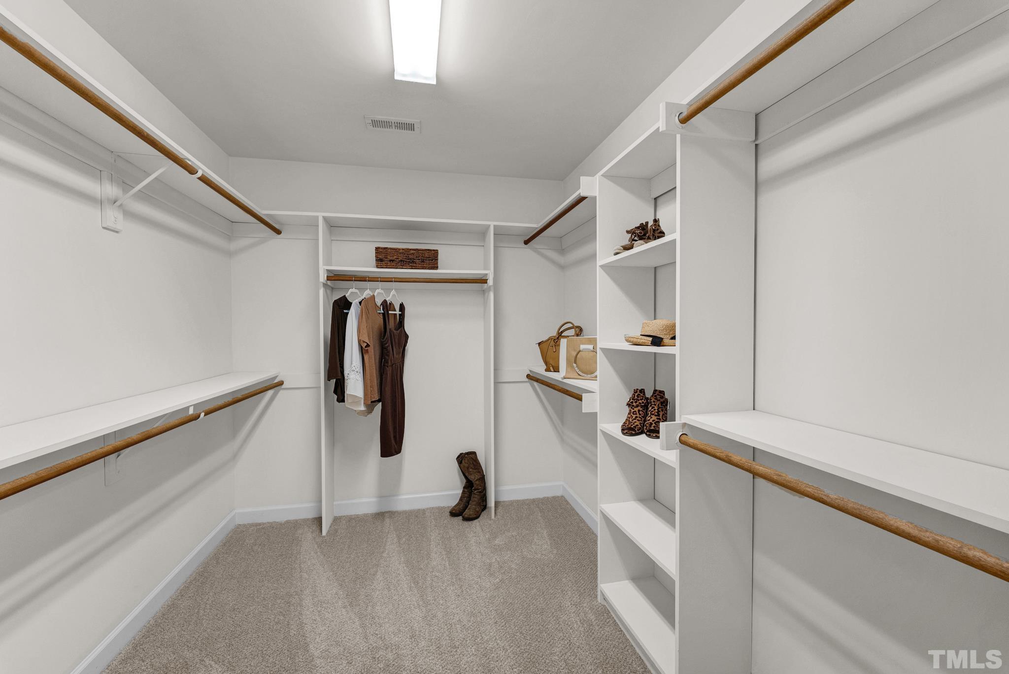 8409 Aptos Court Raleigh, NC 27613 - Photo 34 of 46 a view of walk in closet